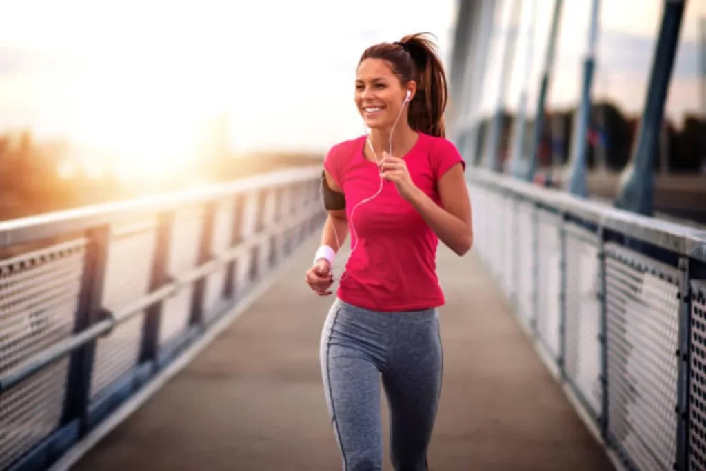 Woman with a pink t-shirt running on a deck