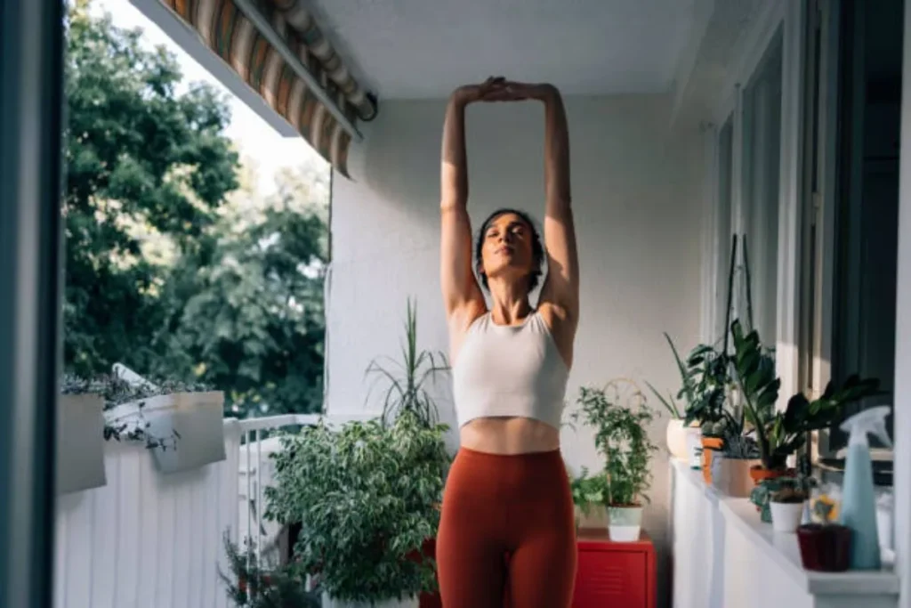 Woman stretching on a balcony