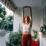 Woman stretching on a balcony