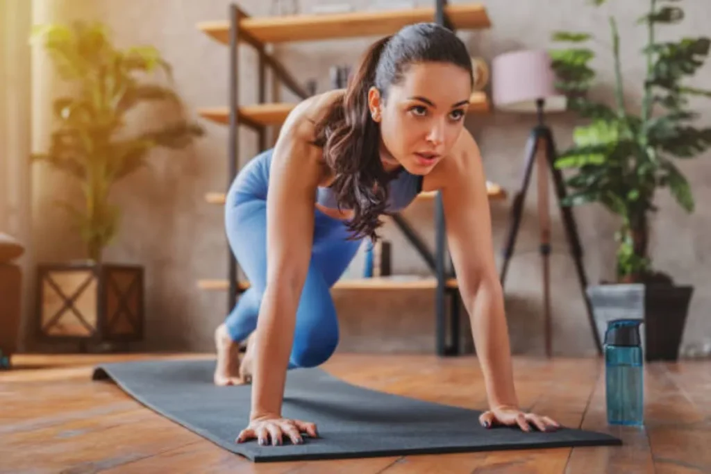 Woman performing exercises on a yoga mat